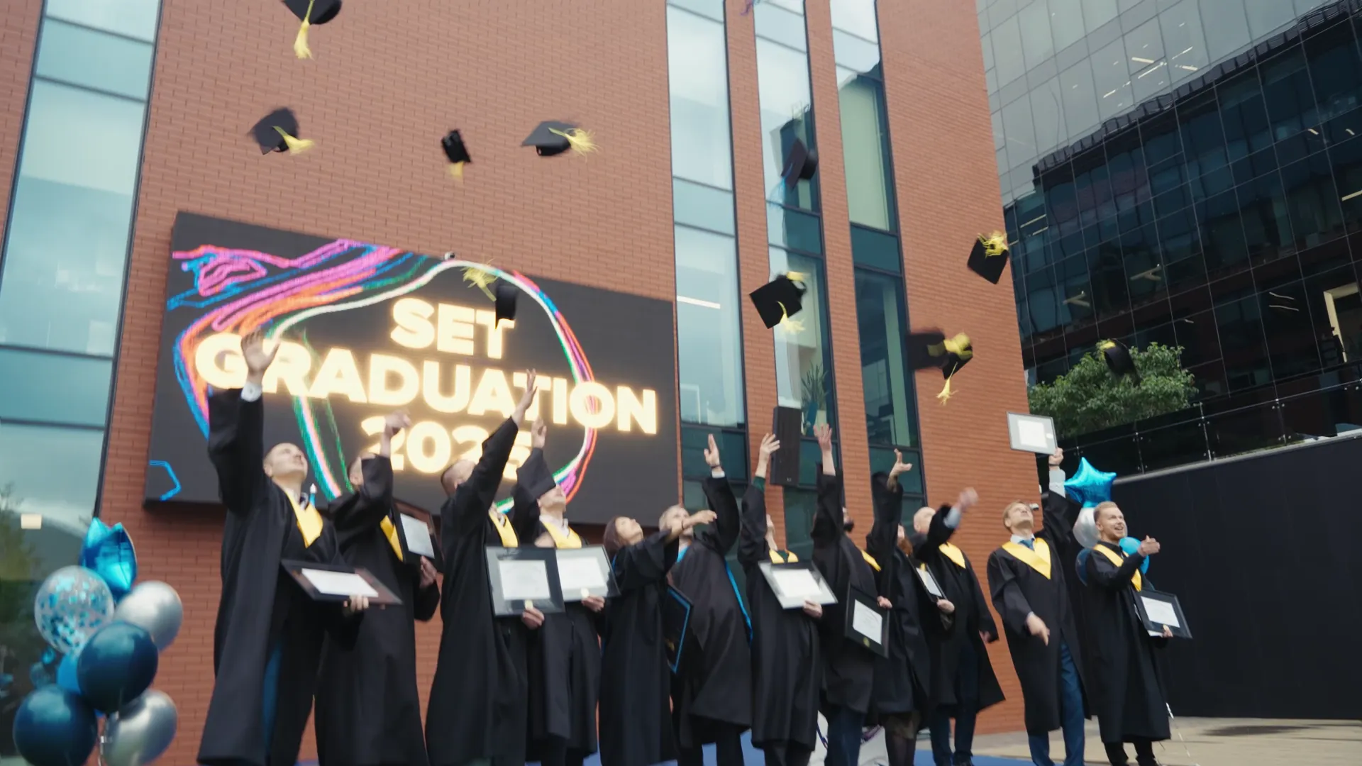SET University 2025 master’s graduates throwing their caps